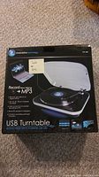 Box of Innovative Technology USB Turntable showing front with product image and feature listings (Record from vinyl to MP3).