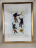 Framed print showing full artwork in gold-tone frame.