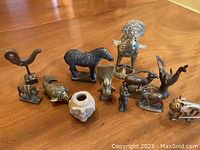 Group overview of all metal figurines and vessels
