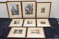 Eight framed prints displayed together on a surface showing size and condition.