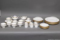 Full set of Wedgwood California china including plates, cups, saucers, creamer and sugar bowl arranged on grey background.