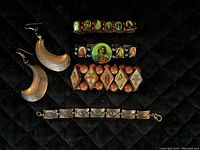 Top view image showing all items including 3 wooden religious-themed stretch bracelets, copper bracelet, and crescent moon earrings.