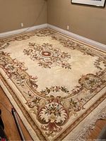 Overall view of rug laid in room corner showing full design, size relative to walls and floor