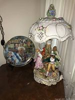 Combined view of porcelain lamp and Israel plate on table