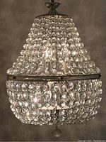 Front view showing cascading octagonal crystal beads and bottom crystal pendant