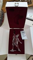 Swarovski crystal Pierrot figurine displayed upright inside white box with red velvet lining and fitted protective insert