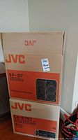 Packaging boxes for JVC SP-D7 speaker system and CA-D75T CD changer unit.