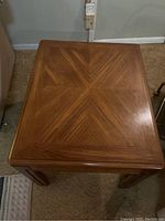 Top view showing chevron inlay pattern on the wooden side table surface