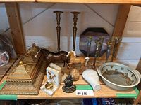 Overview of lot displaying two horses, brass boxes, candlesticks, vase, bowl, onyx egg and desk accessories
