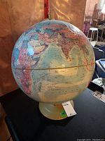 Photo showing the globe from an angle displaying Europe, Middle East, and Africa with countries marked and labeled.