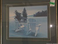 Framed and matted print titled 'Dockside' showing two Adirondack chairs at lakeside with forested islands in background, signed by DA Dunford.