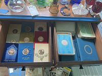 Open drawer showing 27 Franklin Mint Hanukkah and Christmas ornament cards in envelopes, some original boxes included.