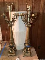 Front view of both lamps with harp frames and unmatched shades behind