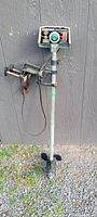 Full view of GameFisher electric trolling motor showing overall shaft, control box, wiring and propeller.