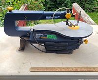 Side view of the Mastercraft scroll saw with visible power cord and base.