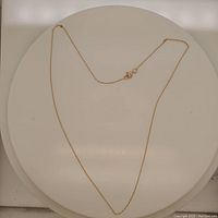 Full view of the 10Kt gold chain necklace laid flat, showing length and design.