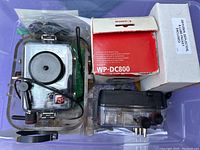Overview of two waterproof camera housings, Canon WP-DC800 box, and Delkin filter box