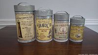 Set of 4 metal rustic canisters with vintage-style nautical labels for flour, tea, coffee, sugar.