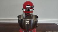 Front view of Empire Red stand mixer with bowl attached