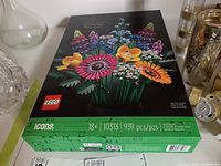 Boxed LEGO set showing front of box with floral bouquet assembled and LEGO and Icons branding