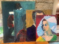 Four oil paintings arranged leaning against a wall showing varied portraits, different sizes, and colorful backgrounds.