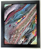 Photo showing the full framed abstract acrylic painting with vibrant multicolored fluid patterns.
