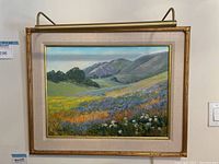 Full frontal view of framed oil landscape painting