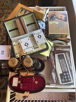 Overview photo showing binoculars, cards, dominoes, Backgammon box, and Computer Gin boxed game