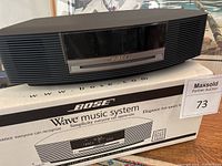 Front view of Bose Wave Music System positioned on its original box