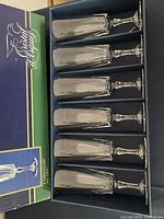 Boxed set of 6 Cristal d'Arques Versailles champagne flute glasses in original blue box with branding