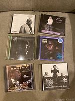 Photo of six CD cases including B.B. King, Barbra Streisand, Billie Holiday, Miles Davis, Lambert Hendricks & Ross.