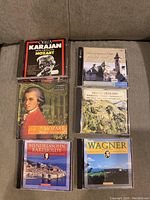 Shows 6 classical music CDs with album covers for Karajan conducting Mozart, Mozart musical masterpieces, old church photo cover, Yehudi Menuhin album, Mendelssohn-Bartholdy, and Wagner.