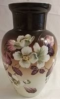 Front view of Bristol glass vase showing hand-painted white and pink flowers with green leaves and brown gradient background.