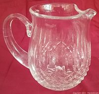 Clear Waterford Irish Crystal jug/pitcher with Lismore pattern and ice lip.