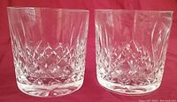 Pair of Waterford Irish Crystal Lismore pattern old fashioned glasses with diamond and wedge cut design, clear crystal, 3 3/8 inches tall.