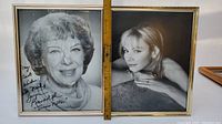 Two framed autographed black and white photos placed side by side with a ruler showing height around 17 inches.