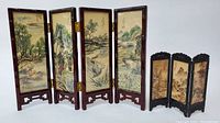 View of both Chinese folding screens showing both the four-panel hand-painted bamboo frame screen and the smaller three-panel carved wood framed screen.