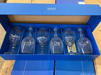 Box containing 6 pilsner glasses with stemware design and clear cut glass pattern from Schott Zwiesel.