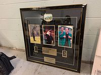 Full view of the framed commemorative display with three photos and scorecard of Mike Weir's 2003 Masters win