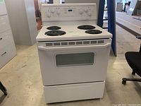 Front view of stove showing oven door and cooktop