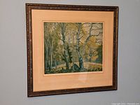 Full view of the framed print showing forest scene with birch trees and original wood frame.