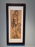 Full view of framed nude charcoal drawing showing entire artwork and frame.