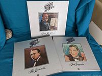 Three box sets of jazz albums featuring portraits of James P. Johnson, Bix Beiderbecke, and Jack Teagarden. Positioned on blue fabric background.