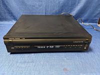 Full front and top view of the Harman Kardon FL 8450 CD player showing overall condition and layout.