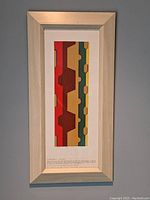 Full view of the framed print showing the entire ribbon work design and frame.