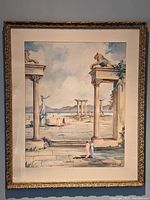 Framed watercolor painting of an ancient surreal scene featuring columns, lion sculptures, and figures in classical attire with a mountainous and waterscape background.