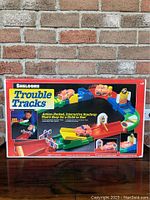 Photo of the original box showing colorful graphics and branding of Shelcore Trouble Tracks.