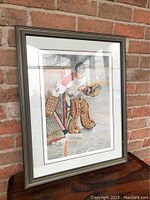 Framed print of a hockey goalie on ice in protective gear, showing full front view and frame condition.