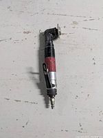 Full length view of Desoutter Brothers air cutoff tool, showing handle, grip, and air hose connector.