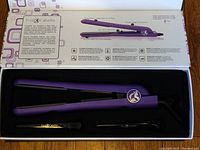 Open box showing purple lilac Pro Cabello Classic Hair Straightener inside with detailed description and features printed on the box inner lid.